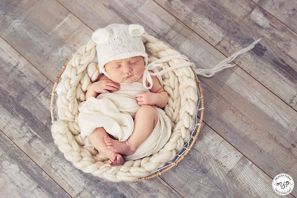 Fine art newborn baby girl with bear hat
