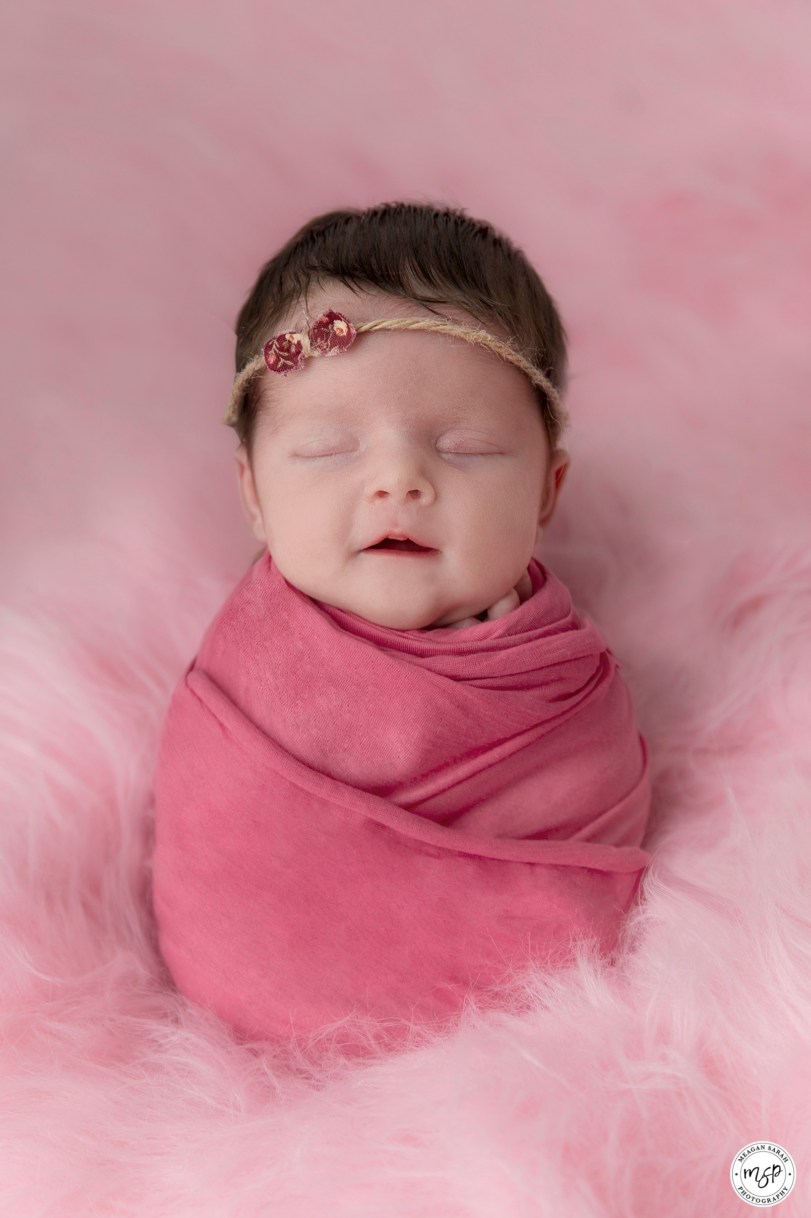 Newborn Photography of Little Girl Nia, Leeds. Pink Swaddle