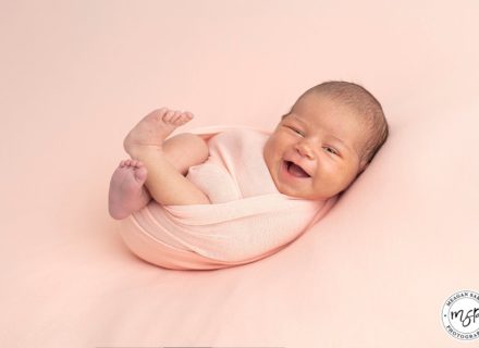 Newborn baby Smiling. Beautiful newborn photos in Horsforth, Leeds.