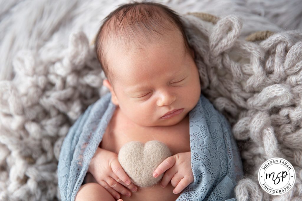 Baby newborn holding felt heart, photoshoot, Leeds, newborn photographer,