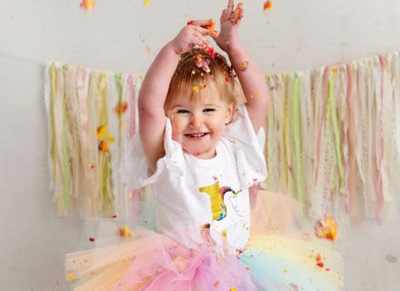 Unicorn Cake Smash with rainbow tutu. Photographed at Meagan Sarah Photography in Leeds. Cake Smash Fun