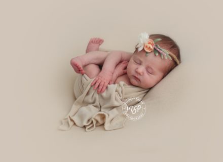 Baby newborn on beige background