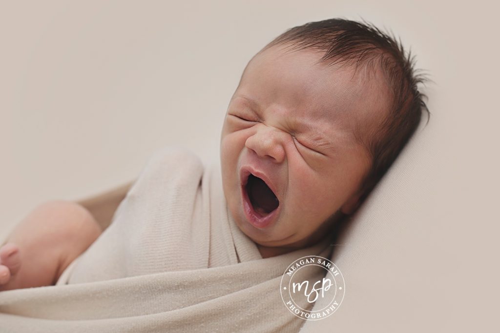 photo of yawning baby