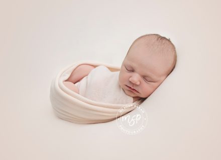 baby photograph in peach background