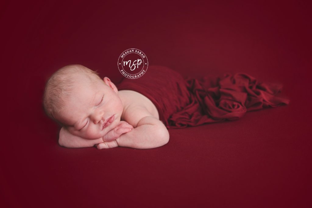 Newborn Baby Girl on Red Background for Valentines day, photo session, Leeds,