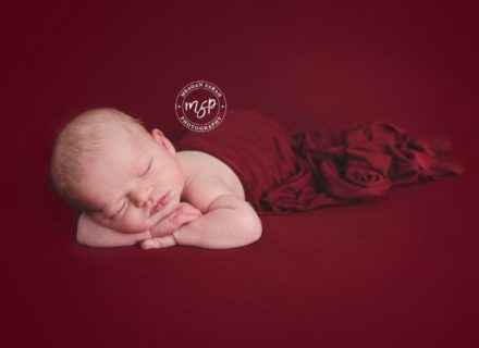 Newborn Baby Girl on Red Background for Valentines day, photo session, Leeds,