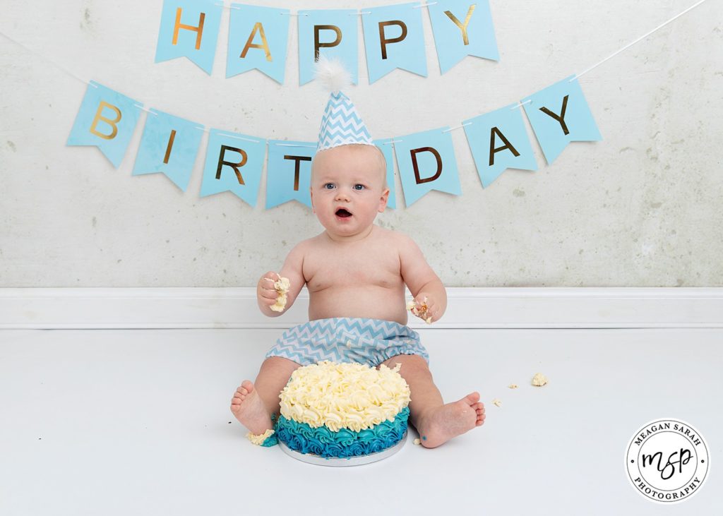 Little baby first birthday cake smash blue theme vintage background