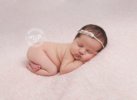 Newborn baby girl photo on pink background in Leeds