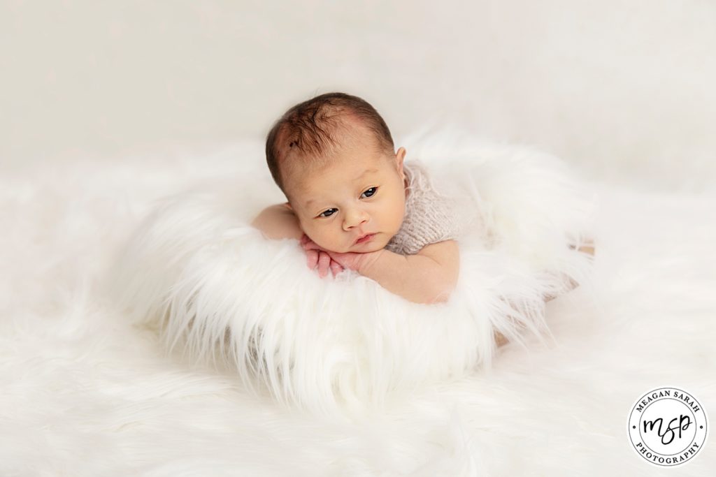 Newborn baby photographer Leeds, white fur, cute baby,