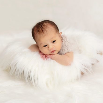 Newborn baby photographer Leeds, white fur, cute baby,