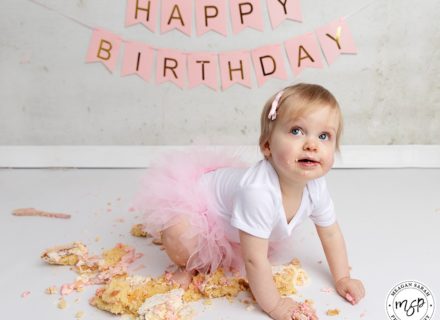 little girl in pink for her cake smash photos Leeds