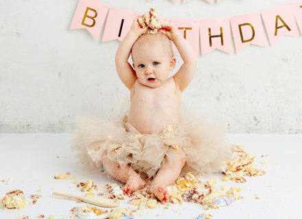 Funny photo of baby cake smash, smashing a cake, photoshoot, baby shower gift idea, Leeds, West Yorkshire, first birthday, present
