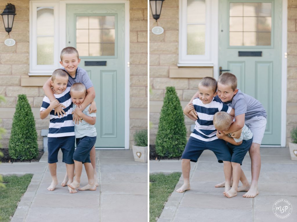 Photos of Doorstep Photography. Family of five outside their home. Picture of doorstep portrait in Horsforth, Leeds by professional photographer, Meagan Sarah Photography. Three brothers having fun and playing. During Coronavirus outbreak. Charity Photoshoot. Rerdrow Houses. Redrow homes. Yorkshire. Horsforth Vale.