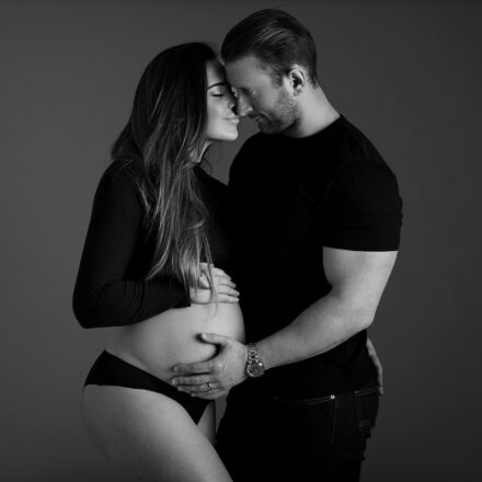 Pregnant couple embrace for the maternity photo shoot in Leeds.