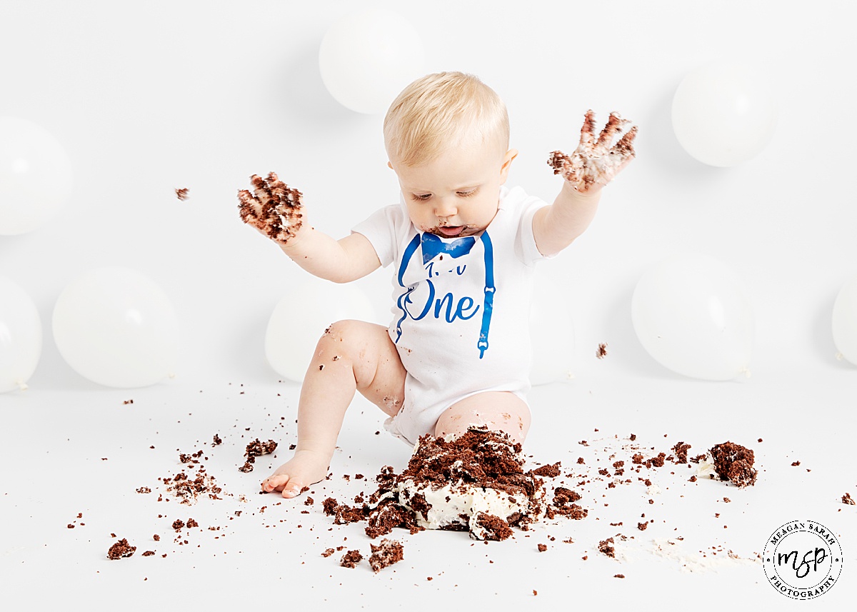 Leeds,Horsforth,Cake,1st Birthday,High End,High Key,Meagan Sarah Photography,Photographer,Photography,Professional,Studio,Studio photographer,Beautiful Photography,Children Photographer,First Birthday,Fun,Funny,Minimal,Modern,Simple,Things to do with a toddler,White background,White balloons,Cake Smash,West Yorkshire,