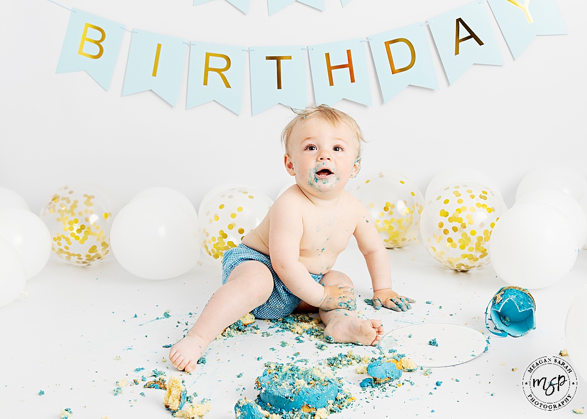 Cake Smash,1st Birthday,Cake,First Birthday,Fun,Funny,Minimal,Modern,Simple,Things to do with a toddler,White background,White balloons,Blue cake,Gold balloon,Studio,Professional,Photography,Photographer,Meagan Sarah Photography,High Key,High End,Children Photographer,Studio photographer,Leeds,Horsforth,West Yorkshire,Happy Birthday,