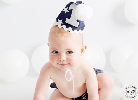 Little boy cake smash session in navy for his first birthday.