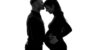 maternity photography. maternity photographer. maternity photographer in Leeds. a black and white image of a couple with facing each other. embracing their baby bump. All in black.
