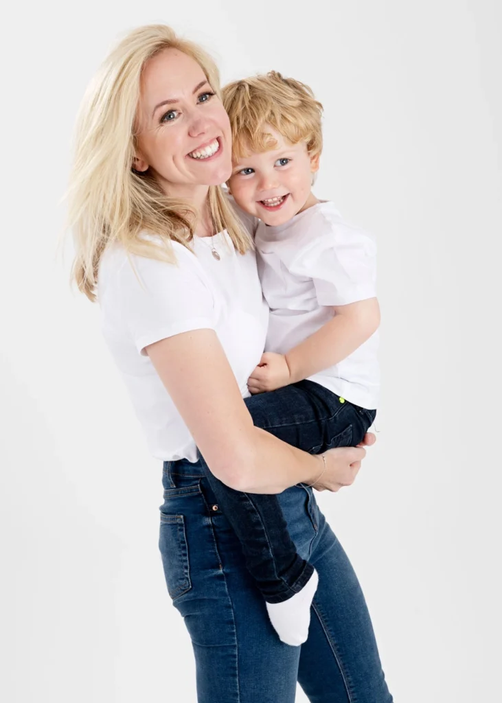 mother kissing son for photo in our Leeds photography studio.