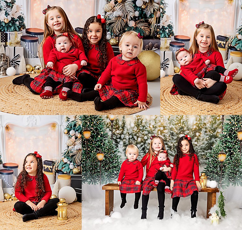Family of 4 little girls made up of sisters and cousins all in red. Posing for their annual Christmas photoshoot. All sitting down, looking at the camera. Faux snow and a faux christmas scene background. Photographed in the studio.
