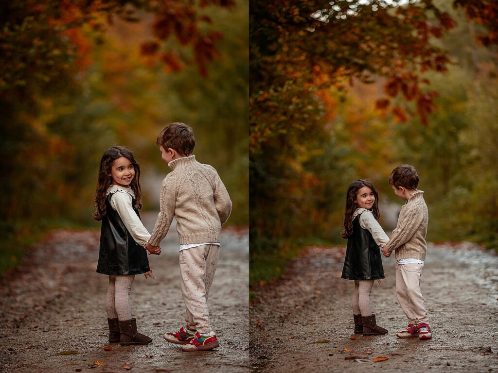 Autumn family photoshoot in Otley Chevin near Leeds – two children playing, holding hands under colourful autumn fall leaves. 